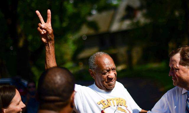 Bill Cosby is welcomed outside his home after Pennsylvania's highest court overturned his sexual assault conviction and ordered him released from prison immediately, in Elkins Park