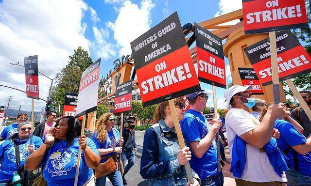 Syndication: USA TODAY May 2, 2023; Los Angeles, CA, USA; Members of the Writers Guild of America picket in front of Dis