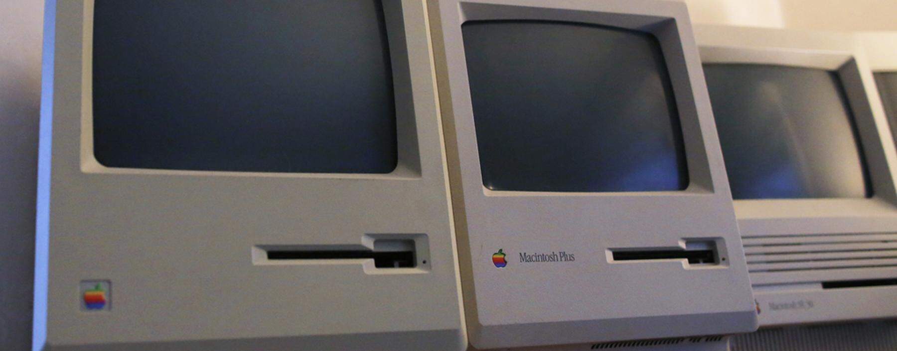The first 128K Macintosh computer sits alongside some of its predecessors at the Vintage Mac Museum in Malden
