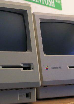 The first 128K Macintosh computer sits alongside some of its predecessors at the Vintage Mac Museum in Malden