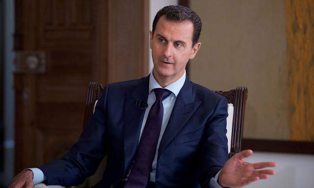 Syria's President Bashar al-Assad speaks during an interview with Australia's SBS News channel in this handout picture provided by SANA