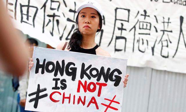 People attend a protest against proposed extradition bill of Hong Kong with China, in Berlin