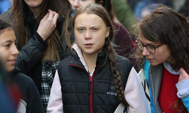 Swedish teen activist Greta Thunberg arrives for the post federal election Friday climate strike march starting and end