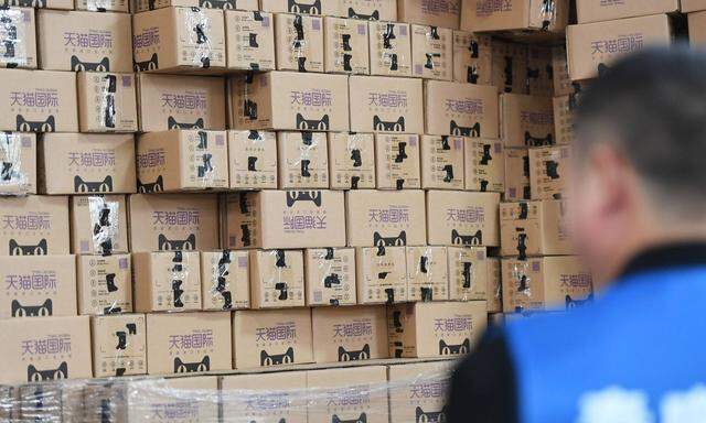 HANGZHOU CHINA NOVEMBER 11 Tmall Global packages pile up at a logistics base during Alibaba Gro