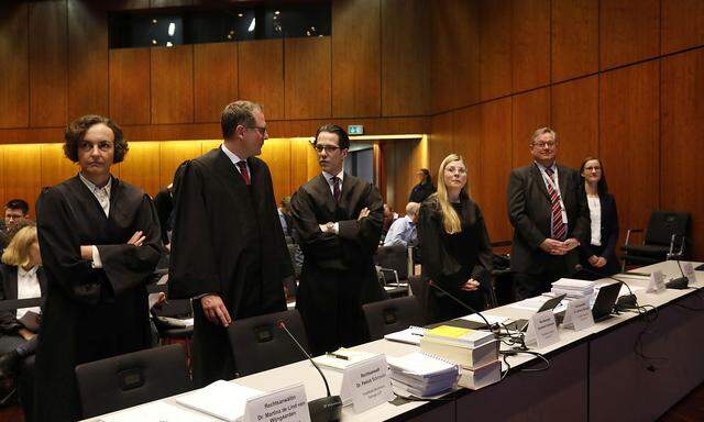 Lawyers prepare before the start of a hearing over the VW diesel emissions cheating scandal, in Braunschweig