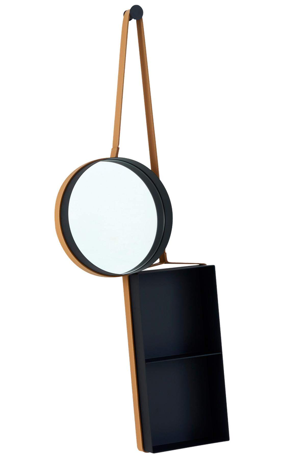 Das „Vanity Shelf“ von Ligne Roset kombiniert das Runde mit dem Eckigen, gleichzeitig einen ledergefassten Spiegel mit einem Regal aus Aluminium. Hängt sich gut ins Bade- oder ins Vorzimmer.
