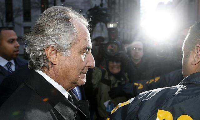 File photo shows Bernard Madoff  departing US Federal Court after a hearing in New York