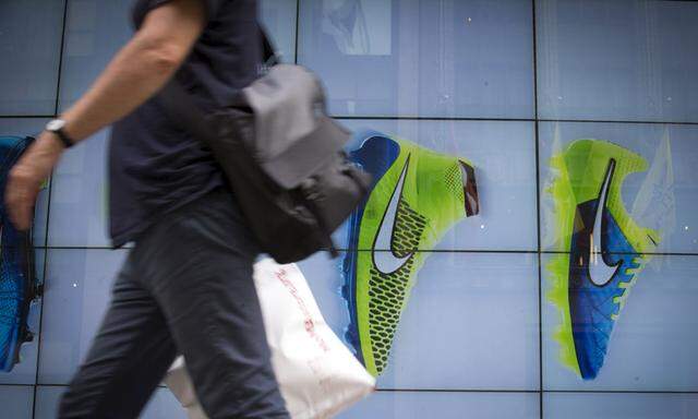 A man passes by the Niketown store in midtown Manhattan in New York