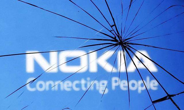 An illustration picture shows Nokia logo through a broken glass