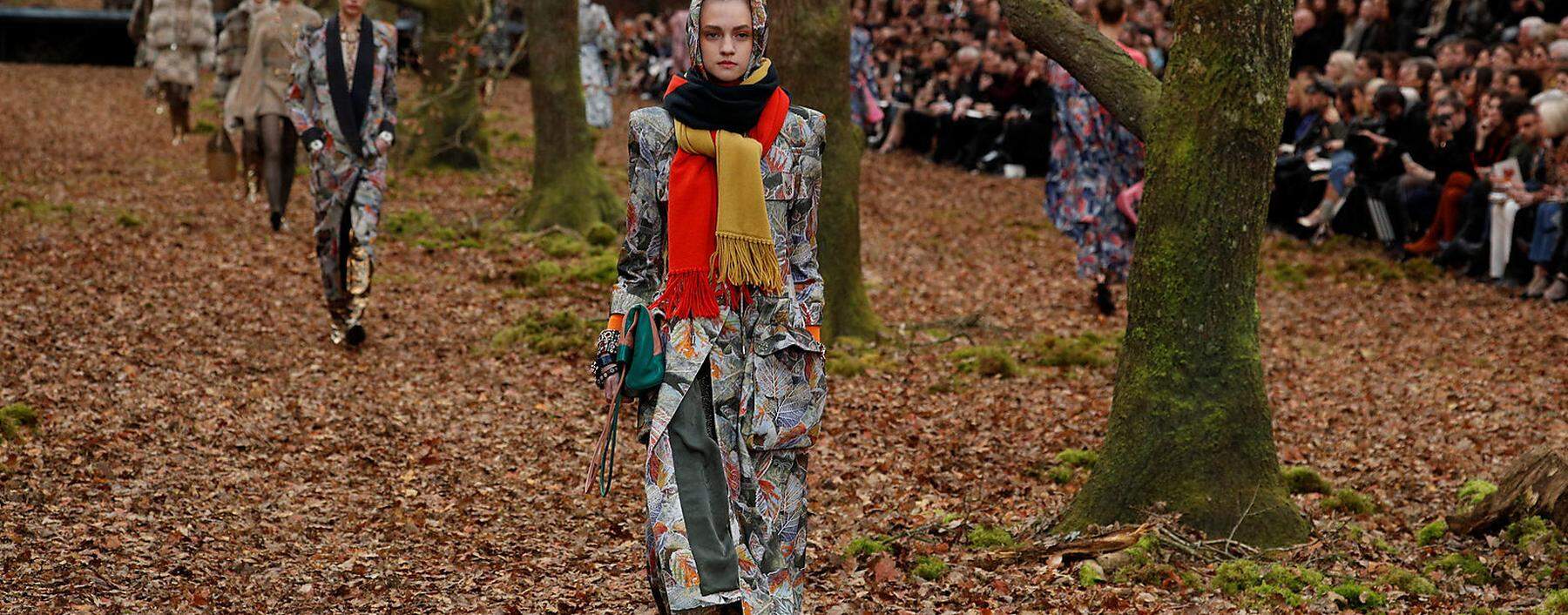 A model presents a creation by German designer Karl Lagerfeld as part of his Autumn/Winter 2018-2019 women's ready-to-wear collection show for fashion house Chanel at the Grand Palais during Paris Fashion Week