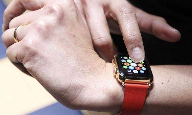 An attendee tries out an Apple Watch folowing an Apple event in San Francisco