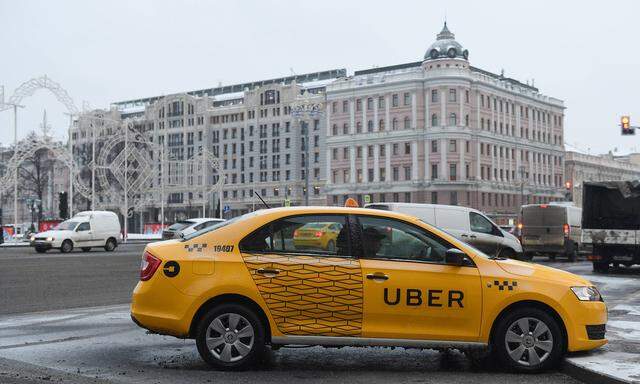 Russia Moscow Yellow Uber taxi car AntonxBelitsky PUBLICATIONxINxGERxSUIxAUTxHUNxONLY