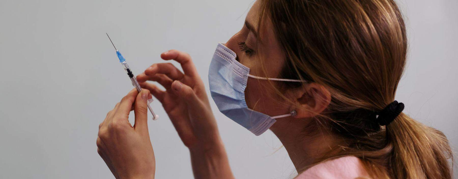 FILE PHOTO: A medical worker prepares to administer a second vaccination injection against the coronavirus disease as Israel continues its national vaccination drive