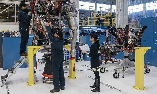 Handout Blue Origin photo shows technicians assembling BE-3 hydrogen engine in the Blue Origin Kent Washington facility