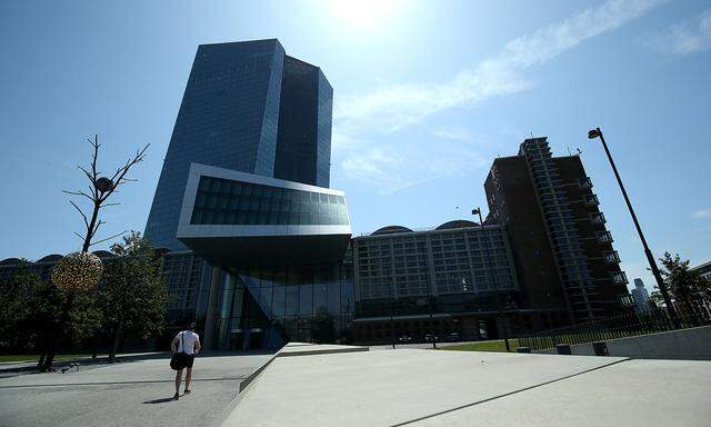 FILE PHOTO: A man walks towards the European Central Bank (ECB) headquarters in Frankfurt, Germany, July 25, 2019.