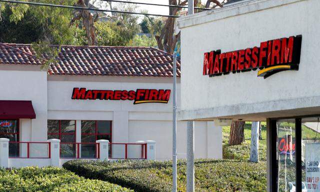 FILE PHOTO: Two Mattress Firm stores lie on either side of the street in Encinitas, California,