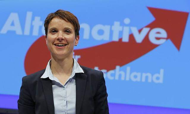 Alternative fuer Deutschland Petry smiles in front of the party's logo at the party congress in Essen