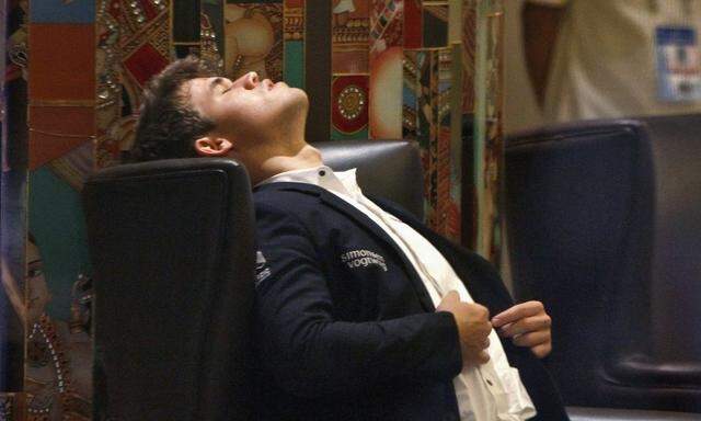 Norway's Carlsen rests before playing against India's Anand during the FIDE World Chess Championship in Chennai