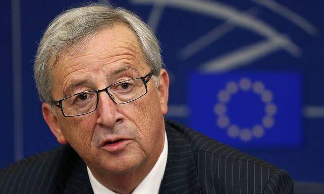 Elected president of the European Commission Juncker answers journalists questions during a press briefing after his election at the European Parliament in Strasbourg