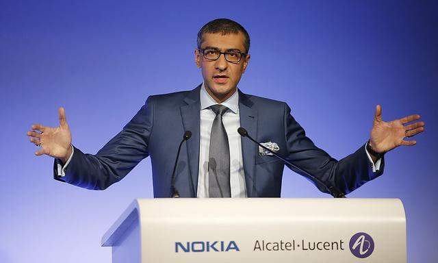 Nokia's President and Chief Executive Rajeev Suri speaks during a news conference with Telecom equipment maker Alcatel-Lucent in Paris