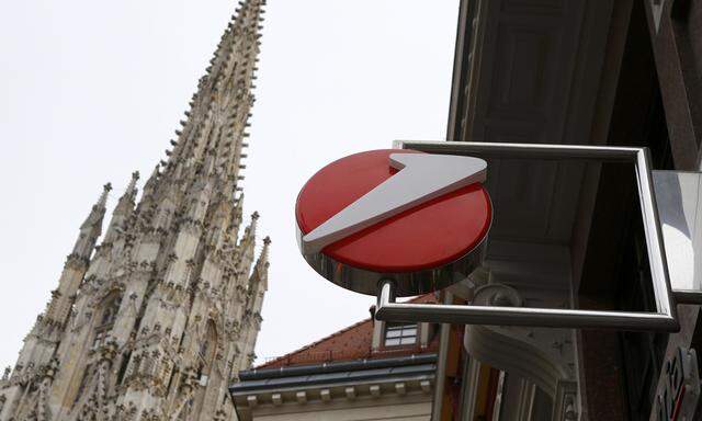 The logo of UniCredit, Italy´s biggest bank by assets, is pictured next to a spire St. Stephen´s cathedral at a UniCredit unit Bank Austria branch office in Vienna