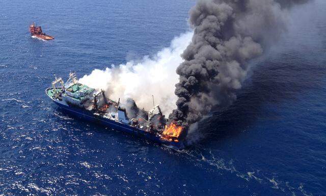 The Oleg Naydenov, a Russian fishing trawler full of fuel, which caught fire over the weekend in Gran Canaria´s port of Las Palmas, can be seen in this handout picture