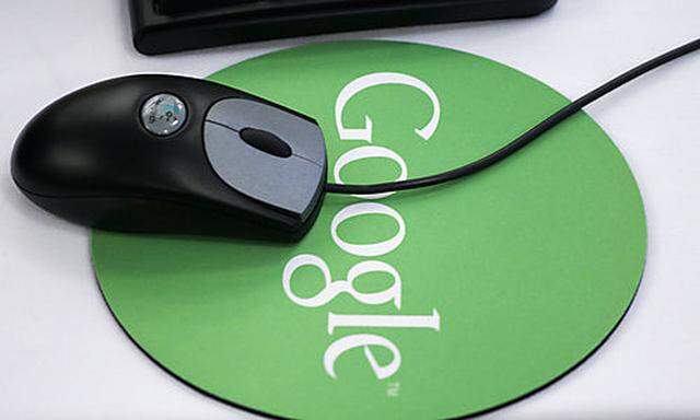 **FILE** A mouse and Google mousepad are shown at Googles New York office in this Friday, Oct. 27, 2s New York office in this Friday, Oct. 27, 2