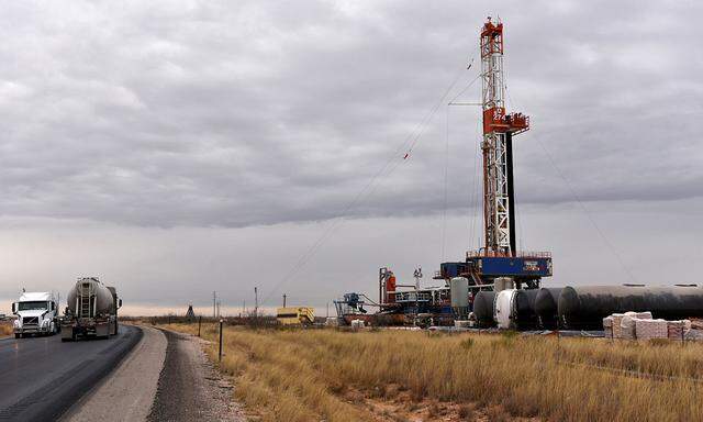 FILE PHOTO: A drilling rig operates in the Permian Basin oil and natural gas producing area in Lea County