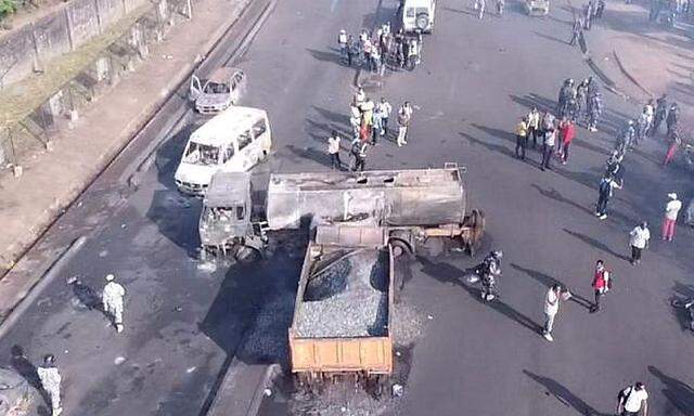 Burnt collided trucks are pictured after a fuel tanker explosion in Freetown