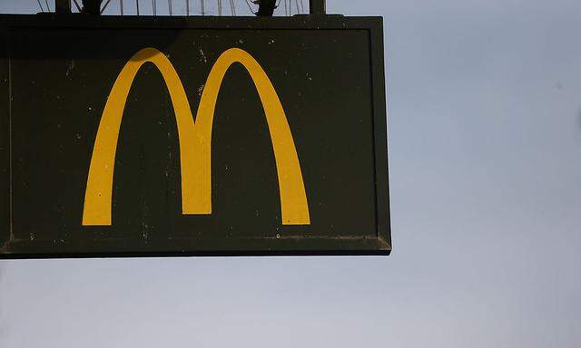 A McDonald's sign is displayed on a restaurant in London