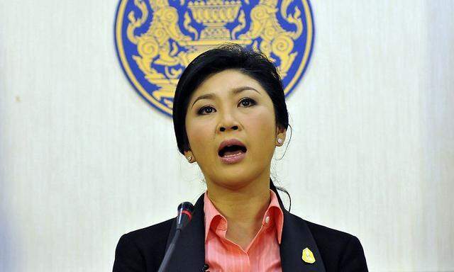 Thai Prime Minister Yingluck Shinawatra talks during a news conference at police headquarters in Bangkok