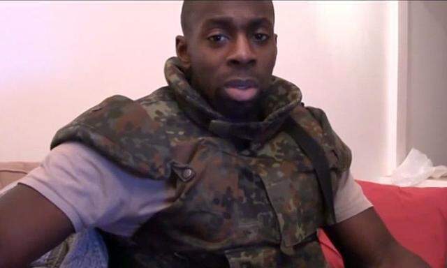 Amedy Coulibaly, one of gunmen behind the worst militant attacks in France for decades, declares his allegiance in this still image taken from video