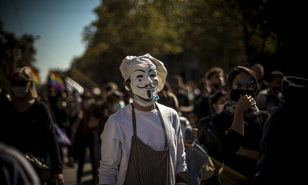 October 16, 2020, Barcelona, Catalonia, Spain: A cook wearing a Guy Fawkes mask takes part in a protest against harsher