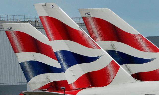 FILE PHOTO: British Airways logos are seen on tailfins at Heathrow Airport in west London