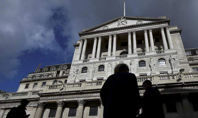 File photo of city workers walking past the Bank of England in the City of London
