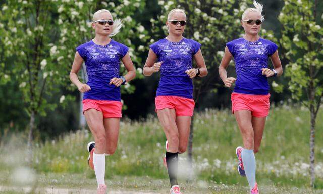 Estonia's olympic team female marathon runners Luik triplets run during a training session in Tartu, Estonia