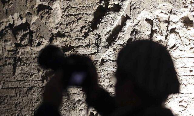 Photographer takes a picture inside the Domus Aurea complex in Rome