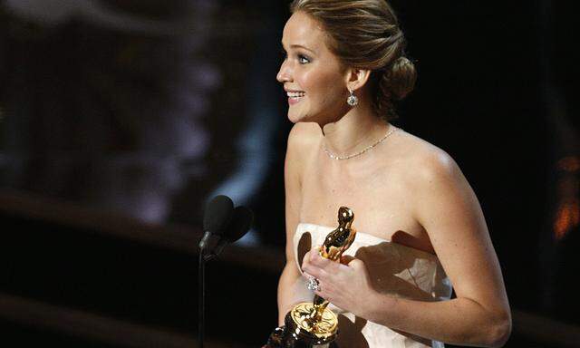 Jennifer Lawrence accepts the award for best actress at the 85th Academy Awards in Hollywood