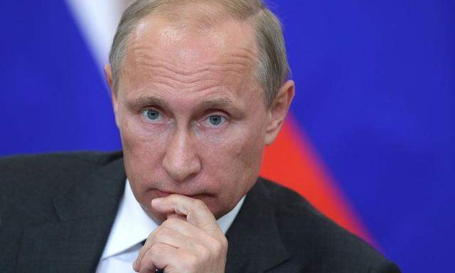 ITAR TASS VORONEZH RUSSIA AUGUST 5 2014 Russia s president Vladimir Putin looks on at a meeting