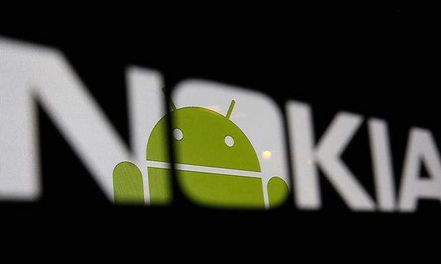 A partial view of an Android logo displayed on a LCD screen is seen through a Nokia logo in the central Bosnian town of Zenica