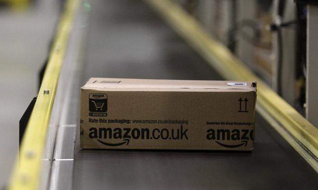 A parcel travels along a conveyer belt at Amazon´s new distribution center in Brieselang
