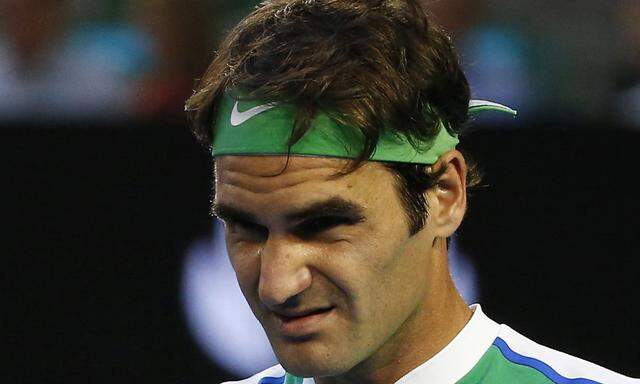 File photo of Switzerland´s Federer reacting during his semi-final match against Serbia´s Djokovic at the Australian Open tennis tournament at Melbourne Park
