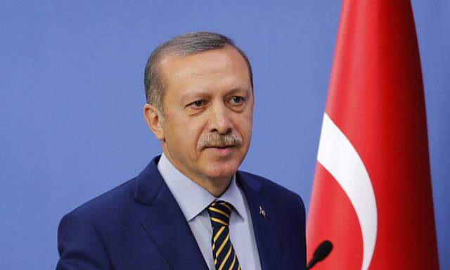 Turkey´s Prime Minister Tayyip Erdogan arrives at a news conference in Ankara