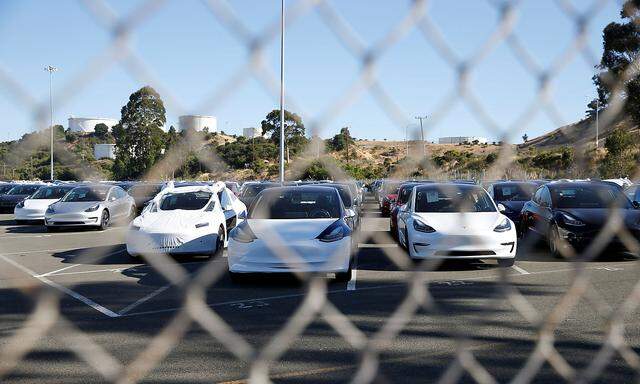 A parking lot of predominantly new Tesla Model 3 electric vehicles is seen in Richmond, California