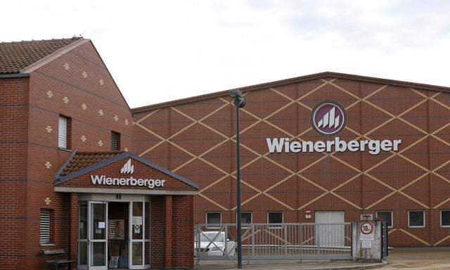 Logos of Wienerberger, the world´s biggest brickmaker, are pictured at its headquarters in Hennersdorf