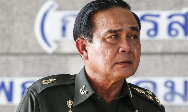 Thai army chief General Prayuth listens to questions from the media during a news conference at the Army Club in Bangkok