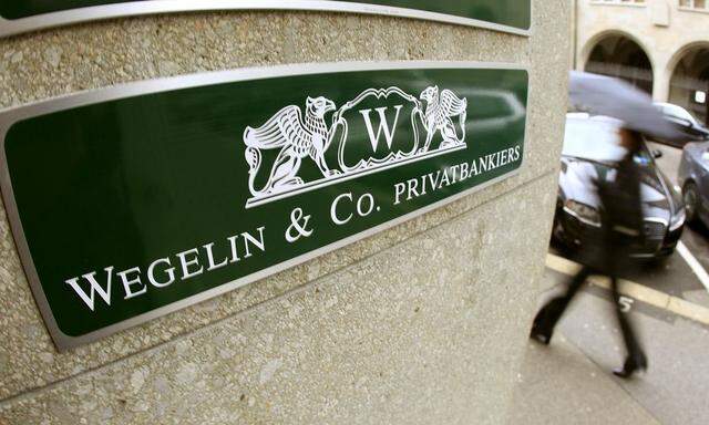The company's logo of Swiss Bank Wegelin is pictured beside the entrance of an office building in Zurich