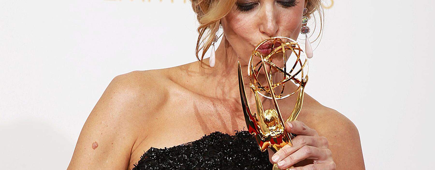Gunn poses with her award for Outstanding Supporting Actress In A Drama Series at the 65th Primetime Emmy Awards in Los Angeles