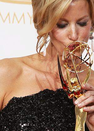 Gunn poses with her award for Outstanding Supporting Actress In A Drama Series at the 65th Primetime Emmy Awards in Los Angeles