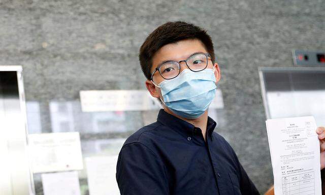FILE PHOTO: Pro-democracy activist Joshua Wong registers as a candidate for the upcoming  Legislative Council election in Hong Kong